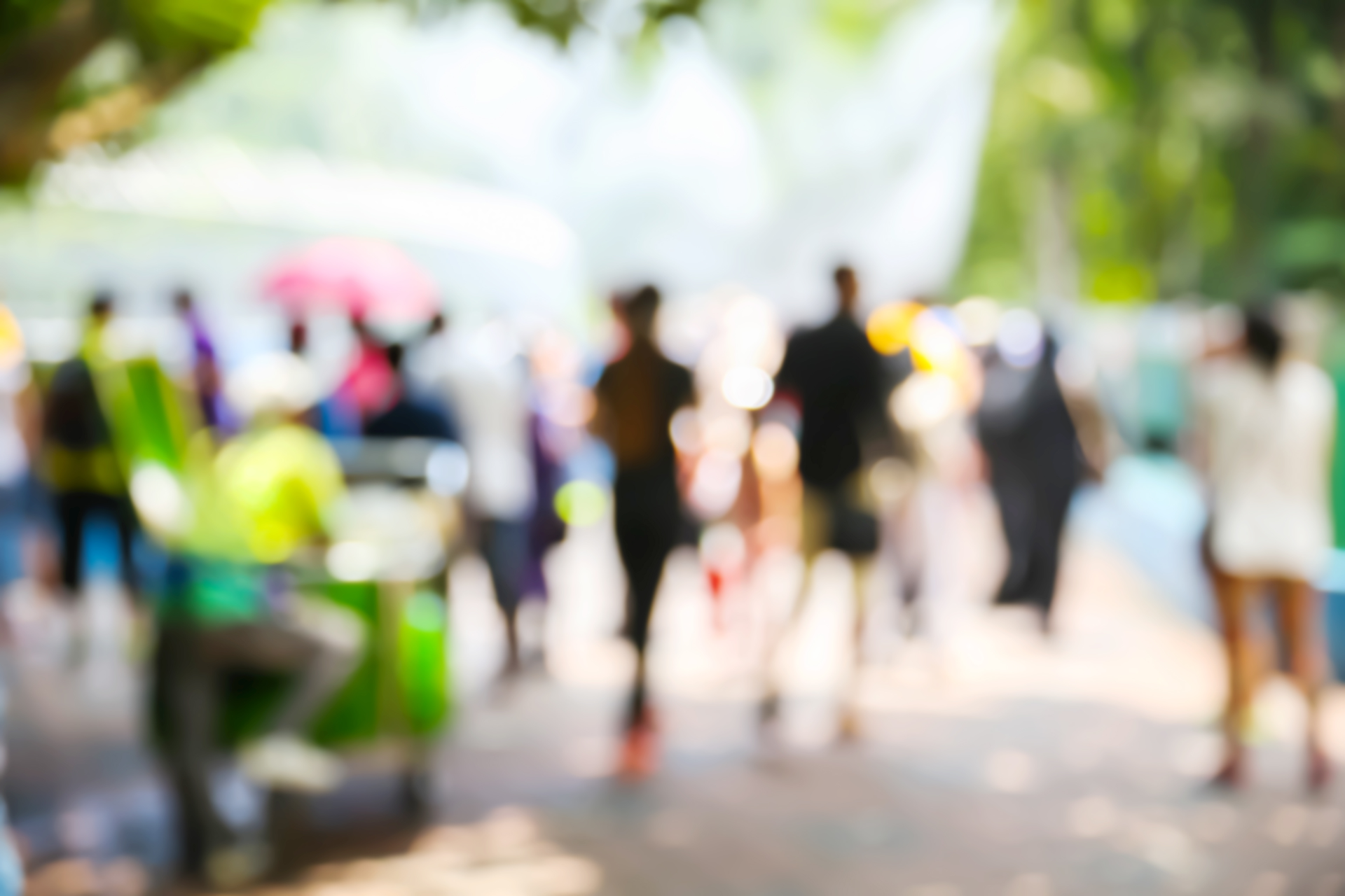 Krogman & Company - About Us - Blurred group of people walking