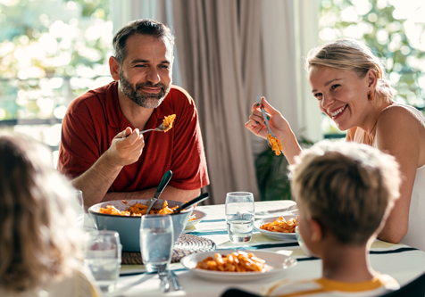 Krogman & Company - About Us - Family enjoying a dinner together in their home
